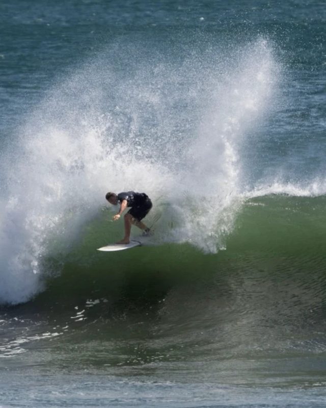 A surfer in a burst of whitewater